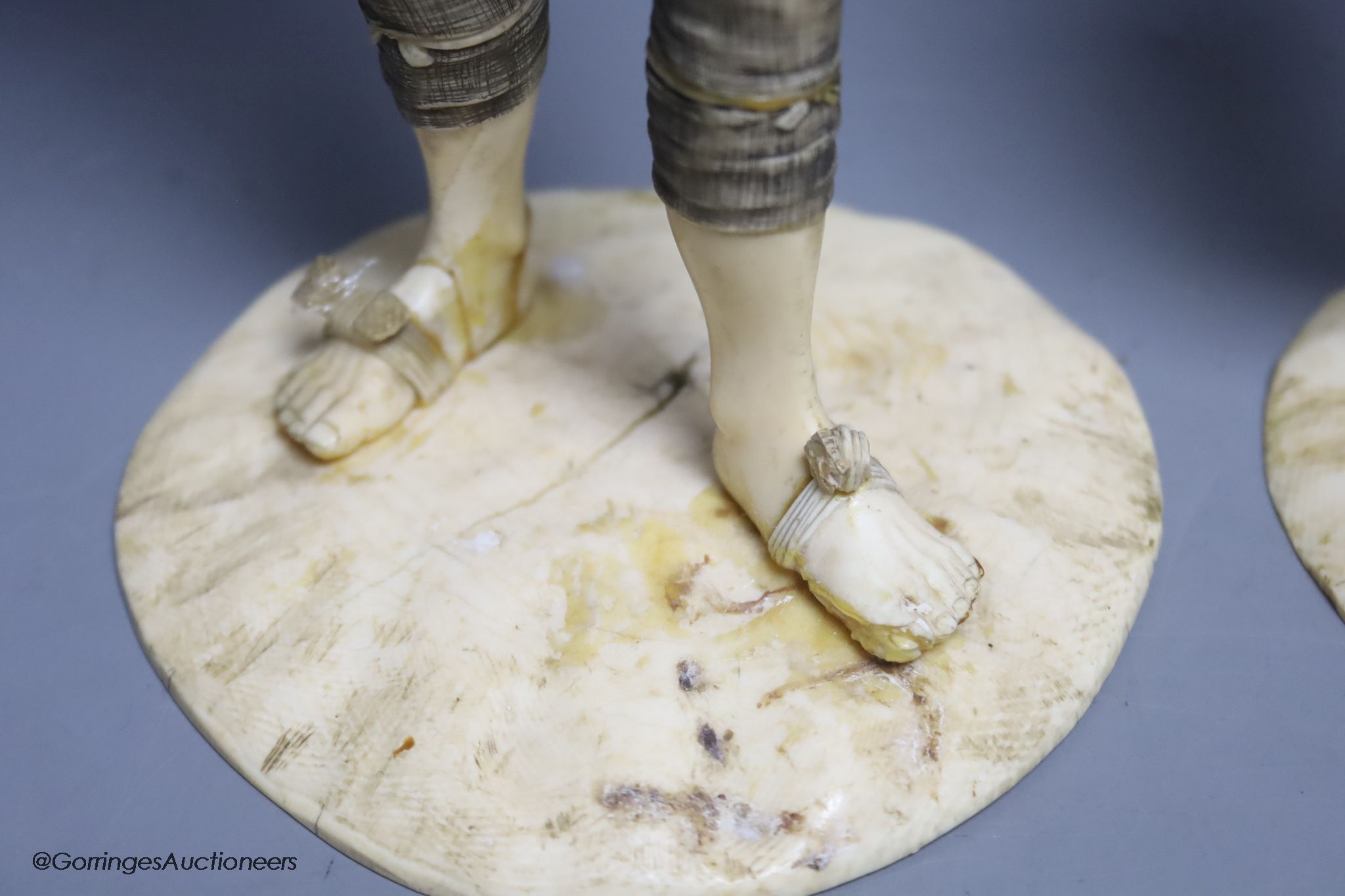 Two Japanese sectional ivory figures of farmers, early 20th century, one signed to base, height 24cm